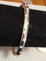 Crystal polka dot bangle bracelet Silvertone flush set stones eternity band
