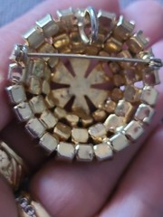 Brooch/pendant in lavender & yellow prong set rhinestones. Dome shape. Vintage