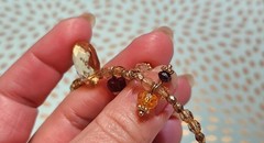 Vtg Cookie Lee faceted Purples/Yellows Lucite Charm Necklace on pale Gold chain