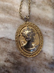 vintage Revlon women’s gold tone chain with metal cameo charm