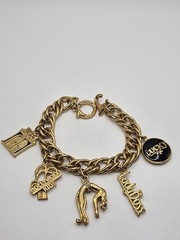 Vintage Jackie Collins Gold Tone Enamel Lady Boss Charm Bracelet Toggle Clasp