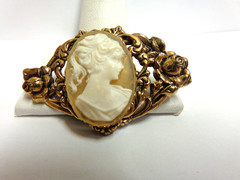 vintage gold tone cameo pin in floral frame sz 2 in wide wgt 9.6 grams girl bust