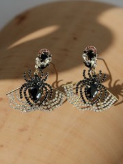 Costume jewelry earrings titled ‘Spider Rhinestone Earrings’ by Piper K