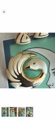 Vintage cream & gold enameled metal clip on earrings and swan brooch