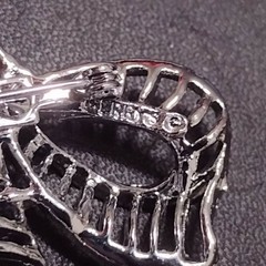 Gerry’s silver tone bow brooch