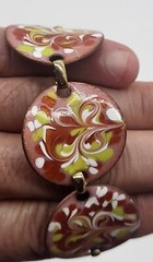 Vintage 7″ enamel on copper bracelet, round, bent sections, fold over clasp