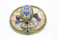 Antique Egyptian Revival winged scarab brooch featuring vibrant enamel work