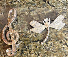 2 vintage unbranded Clear Rhinestone brooches in silvertone: G Clef & Dragonfly