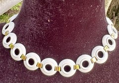 vintage Monet choker necklace featuring white enamel rings joined by gold tone