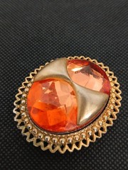 DENISE 195Os goldtone applied bow large faceted orange glass stone brooch