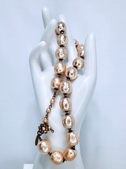 Miriam Haskell statement necklace featuring oversized faux baroque pearls.
