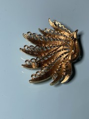 Vintage Monet Gold Tone Textured Peacock Filigree Brooch