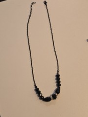 vintage-style beaded necklace black faceted beads and silver-toned spacers.