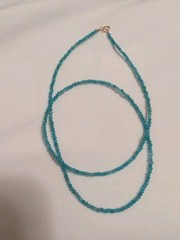 17″ 2.5 mm Neon Apatite bead necklace with 14 k gold clasp