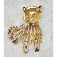 Vintage gold-tone cat brooch with red rhinestone eyes and white beaded accents