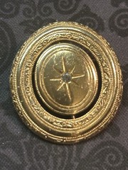 Vintage 1970s Avon Spinner Brooch Gold Tone Rotating Starburst Rhinestone Signed