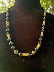 vintage-style black and gold beaded statement necklace,