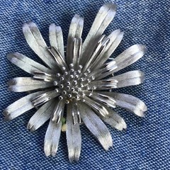 TRIFARI Brooch Pin Flower Floral Burst signed – silvertone relief 2.25″ diameter