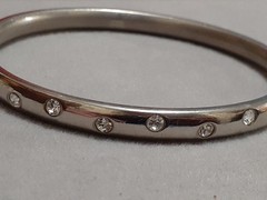 Crystal polka dot bangle bracelet Silvertone flush set stones eternity band