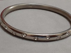 Crystal polka dot bangle bracelet Silvertone flush set stones eternity band