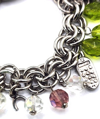 Vintage silvertone & glass charm bracelet with rare car, gold card, cell phone