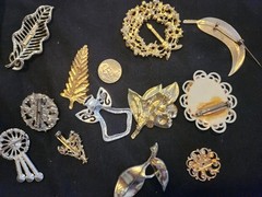 12 vintage Brooches. 1.5 inches – 3 inches big.
