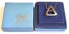 The Charlie Triangle Silver Tone Pendant Charm by Revlon Original Box Never Used