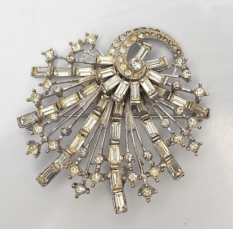 Antique silver tone metal and rhinestones sparkling swirl brooch pin