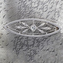 Antique Edwardian platinum Old European diamond brooch/lapel pin. By Krementz.