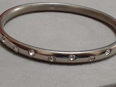 Crystal polka dot bangle bracelet Silvertone flush set stones eternity band