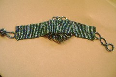 VTG- WIDE MULTICOLOR GLASS SEED BEADED LARGE CENTER FLOWER ADJUSTABLE BRACELET