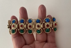 Vintage Gold Tone multi-gemstone link bracelet with a fold-over clasp 7’ in
