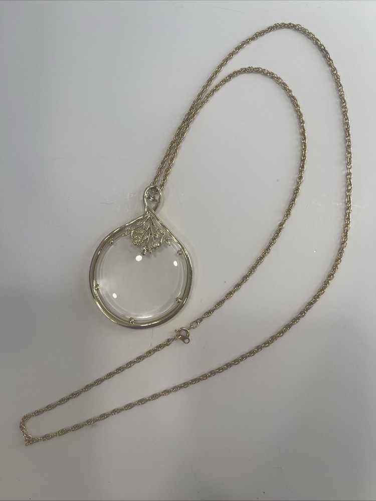 Vintage Magnifier Pendant Necklace. Gold tone. Made in USA in 1960’s. Hangs 15”