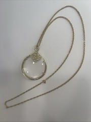 Vintage Magnifier Pendant Necklace. Gold tone. Made in USA in 1960’s. Hangs 15”