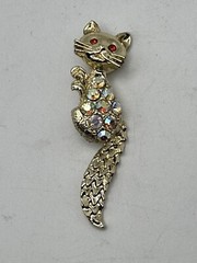 Bejeweled Feline Brooch Gold Tone With Man Made Aurora Borealis And Red Stones