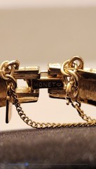 Monet gold tone bracelet with safety chain w/shiny and matte finish