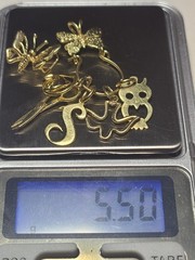 5.50 14K SOLID YELLOW GOLD, 6 14K Charms and one heavy charm holder