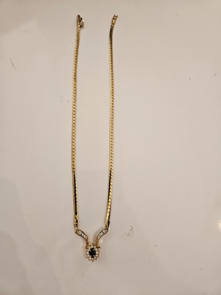 Gold tone necklace with black stone and cz’s.