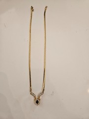 Gold tone necklace with black stone and cz’s.