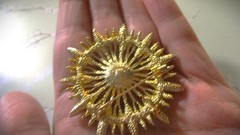 gold tone starburst brooch with purple & clear zircons + a large faux pearl