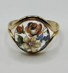 Vintage French flower medallion cuff bracelet gold-toned metal and resin.