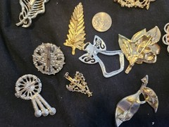 12 vintage Brooches. 1.5 inches – 3 inches big.