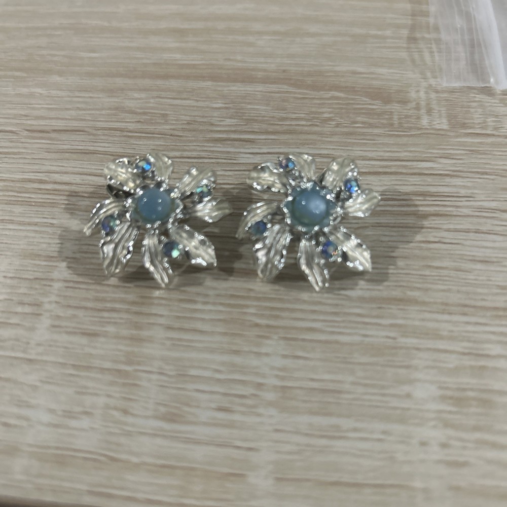 Vintage Judy Lee rhinestone and blue aurora borealis moon glow clip on earrings