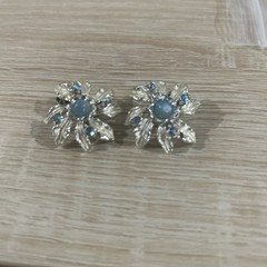 Vintage Judy Lee rhinestone and blue aurora borealis moon glow clip on earrings