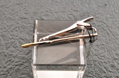 Near mint, gold and Cufflinks and silver tie clip, “Yves Saint Laurent”, case.