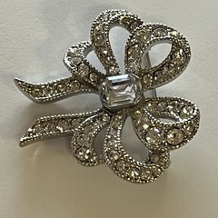 Vintage Monet Clear Rhinestones Bow Brooch Silver Tone Emerald Cut Center Stone