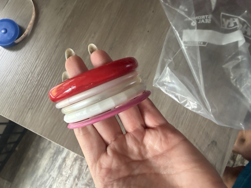vintage colorful plastic lucite bangle bracelets. Pink , red and white