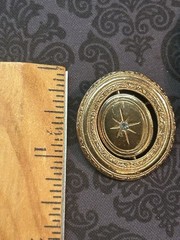Vintage 1970s Avon Spinner Brooch Gold Tone Rotating Starburst Rhinestone Signed