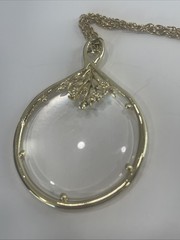 Vintage Magnifier Pendant Necklace. Gold tone. Made in USA in 1960’s. Hangs 15”