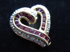 14K Solid Gold, (16) Diamonds & (22) Ruby’s. Heart Pendant.
